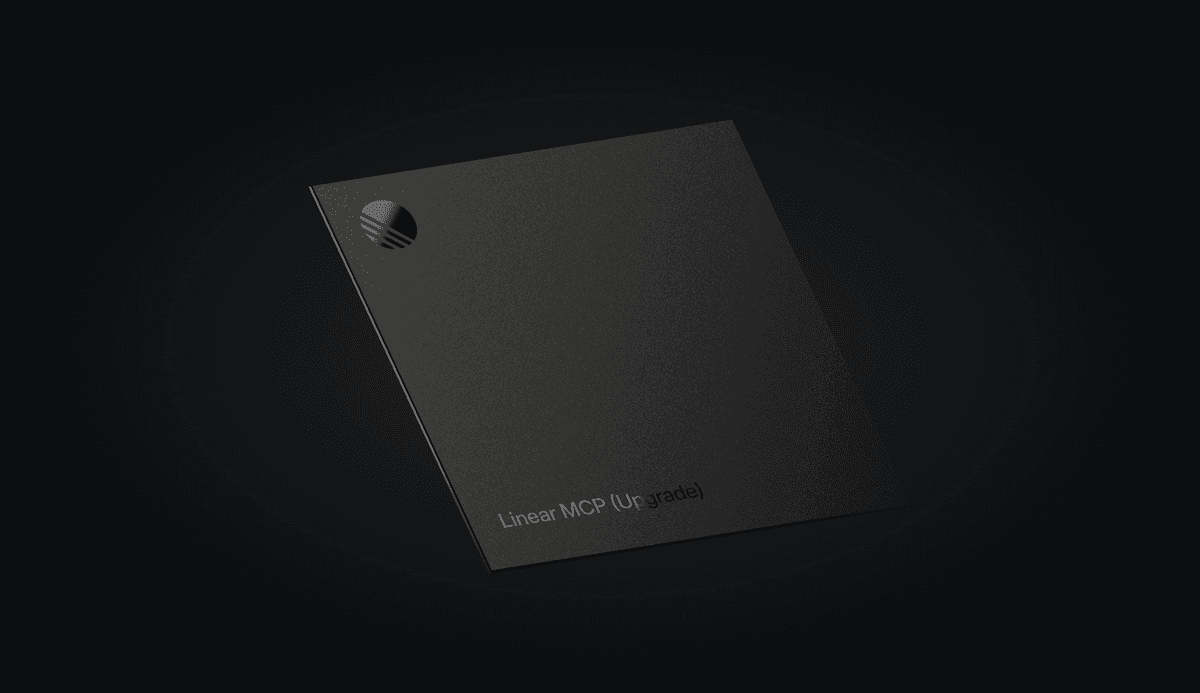A dark, minimalist 3D render of a matte-black rectangular card angled against a black gradient background. The card features a small circular Linear logo cutout near the top-left corner and subtle engraved text near the bottom reading “Linear MCP (Up-grade).” The overall look is sleek, understated, and premium.